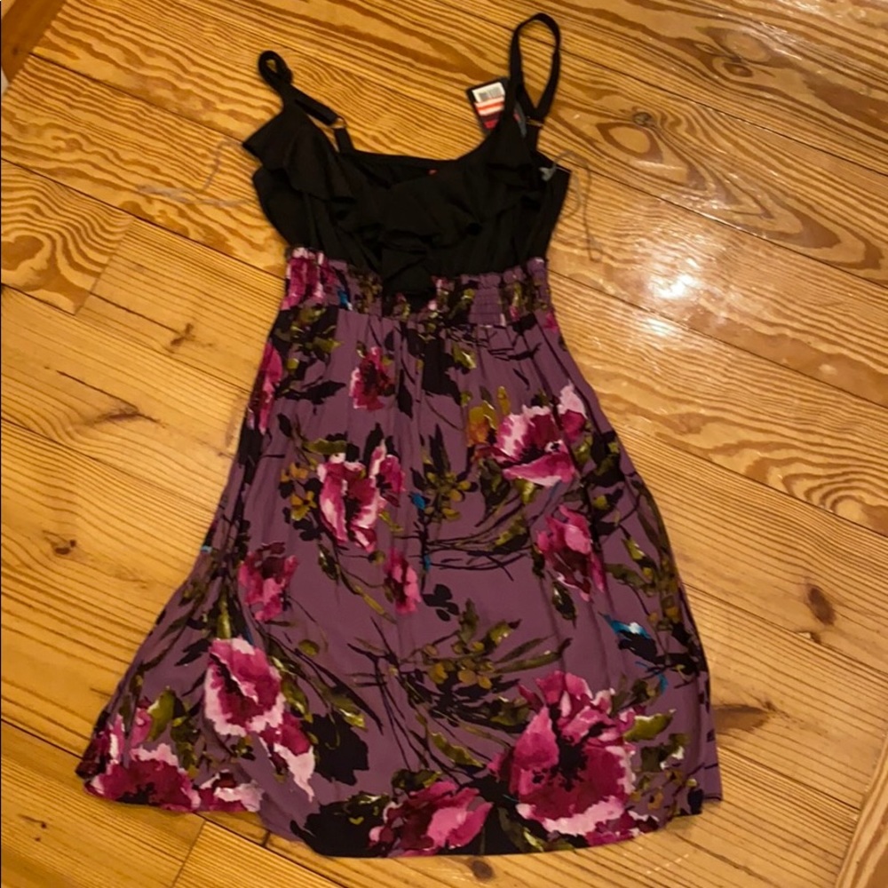Purple floral dress with a black bodice and ruffle